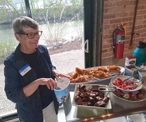 Kath serving dinner.jpg